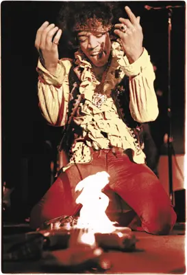 jimi hendrix lights guitar on fire