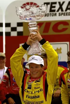 Winner Scott Sharp hoists the Foyt-Rutherford Trophy. IRNLS Casino ...
